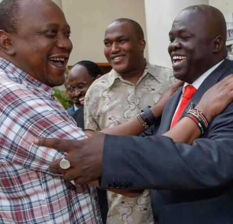 Undated photo of Bill Arocho and President Uhuru Kenyatta sharing a light moment at a past event.