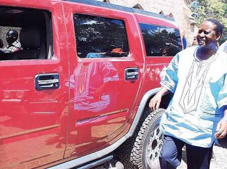 Former Prime Minister Raila Odinga standing next to a hummer gifted to him in 2007.