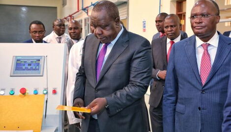 CS Fred Matiang'i alongside Transport CS James Kamau at the digital license plate launch in Nairobi on August 30, 2022