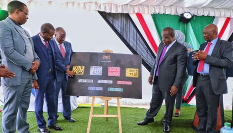 CS Fred Matiang'i second from right commissioning the new digital number plates in Nairobi on August 30, 2022