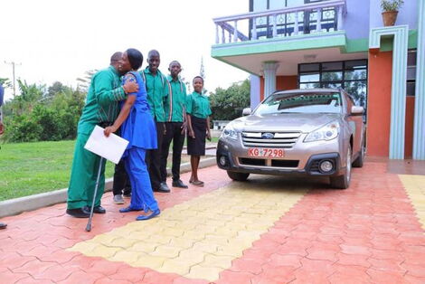 Jubilee nominated MP David Ole Sankok embraces his wife after surprising her with a brand new Subaru in September 2019.