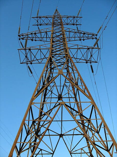 An image of a high voltage transmission power line tower.