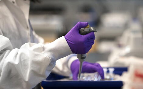 A Moderna scientist works in the company's lab. 