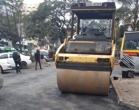 A road construction machine in the Central Business District on July 8, 2021