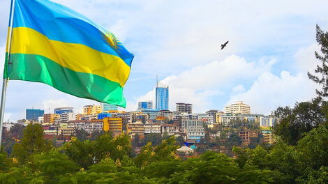 A Rwandan Flag overlooking a city.