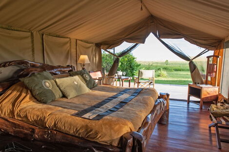 A bedroom at JW Marriot Masai Mara Lodge