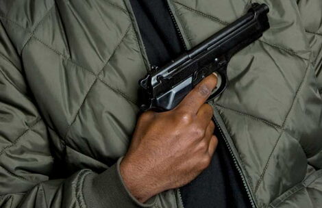 A man carrying a gun.