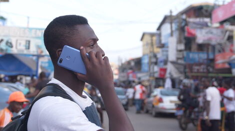 Photo of a man using a phone in Nairobi