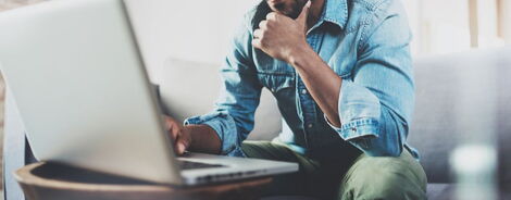 A man working using a laptop. Following the Covid-19 outbreak, working from home is the new normal