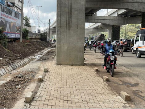 A pillar built on a pedestrian's pavement