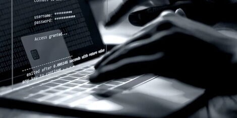 A sillhoute of a hacker using a computer.jpg