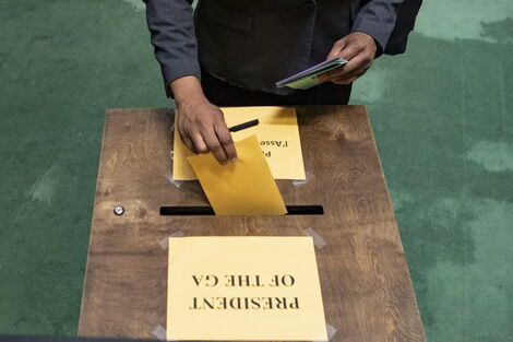 A voter casting a ballot at the United Nations General Assembly on June 17, 2020.