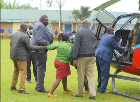 A woman Attempting to Speak to Interior CS Held Back By Police Officers.