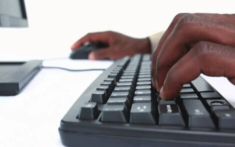 File photo of a person typing on a computer keyboard