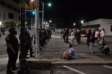 Activist face off with Police during a North Carolina Protest where Dedan Waciuri was arrested in May 2020.