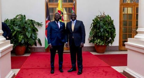 Nigerian national, Alexander Ezenagu and president William Ruto pose for a photo at State House on September 13, 2022.