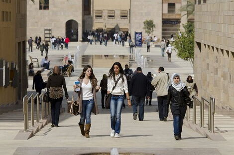 American University students walking around a college campus 
