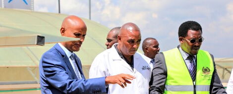 DCI boss Mohamed Amin (left) examines the top floor of an apartment in Kasarani, Nairobi on March 28, 2023. 