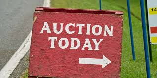 A directional signage for an auction.