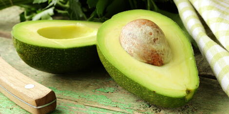 An avocado split in half.