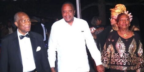 An image of Retired Ambassador, the late Nicholas Mugo, President Uhuru Kenyatta and his wife, Beth Mugo, cutting a cake during their 61st marriage anniversary in September 2019.