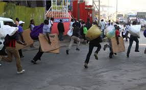 An image of traders running from county askaris