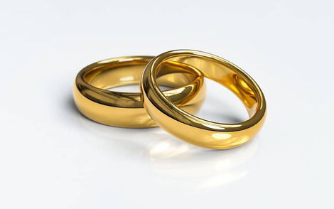 An undated photo of two identical wedding rings.