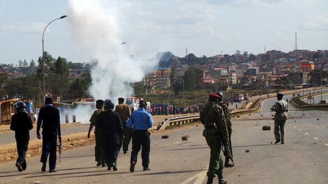 Anti-riot officers pictured along Thika Superhighway, Githurai area during a mass protest on September 9, 2014.