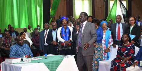 Azimio One Kenya presidential candidate Raila Odinga presents his concerns to IEBC Chairman Wafula Chebukati at the Bomas of Kenya on Sunday, June 5, 2022.