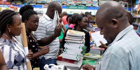 Parents purchasing books at a bookstore in Mombasa County during school reopening in 2021.