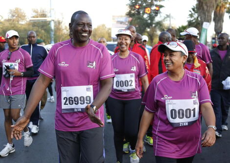 Deputy President William Ruto (left) and First Lady Margaret Kenyatta participate in the Beyond Zero run on March 8, 2015.