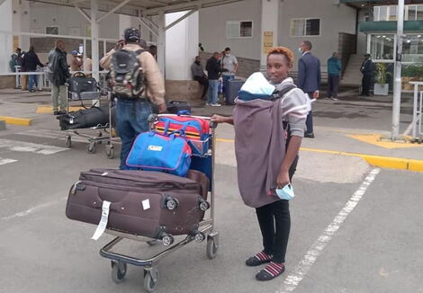 Baby Muiruri's mother at JKIA after returning from India.