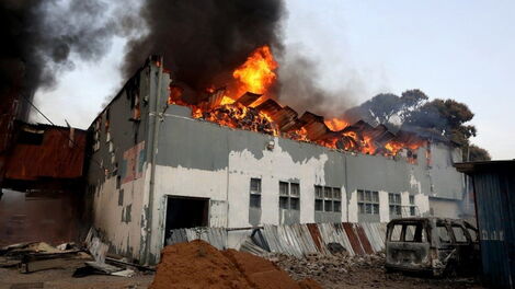 Building set on fire as South Africans protest arrest of former President Jacob Zuma.
