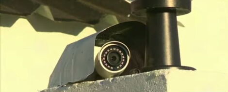 A CCTV surveillance camera fitted on one of the walls. 