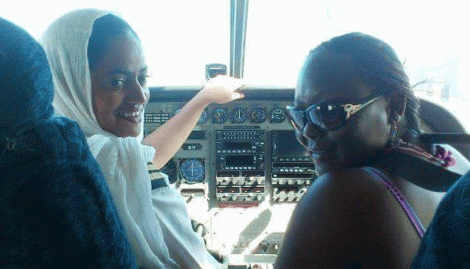 An undated image of captain Ruweida Mohamed(left) flying a plane.