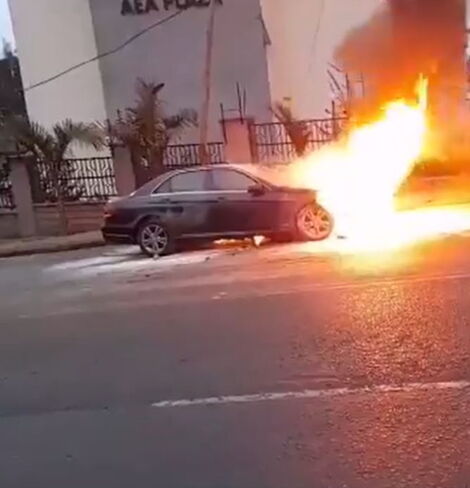 Photos of a Mercedes Benz up in flames along Valley Road in Nairobi