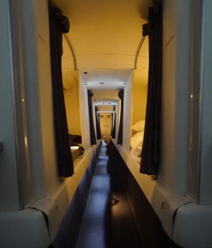 A door leading to the sleeping area where the cabin crew take a break.