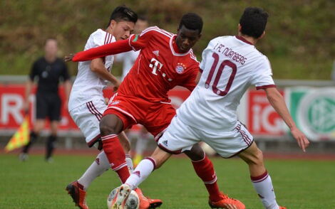 Kenyan defensive midfielder Bernard Mwarome playing during a past Bundesliga match.