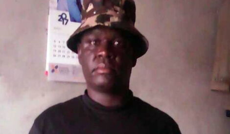 Benson Imbatu, a police officer attached to the Kabete police station, poses for a photo.