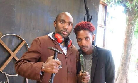 Paul Kihuha (also known as Protisa) with comedian Erick Omondi at his workshop.