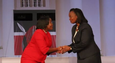 Roots Party deputy presidential candidate, Justina Wamae (left) greets her Agano party counterpart, Ruth Mucheru during the 2022 Deputy presidential debate held at CUEA, Karen, Nairobi on July 19, 2022. 