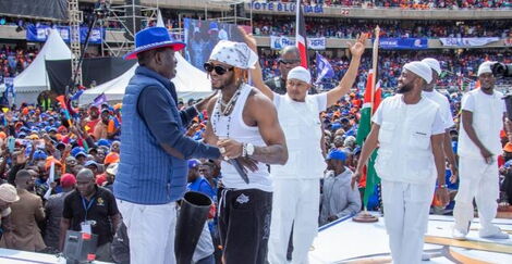 Azimio la Umoja presidential candidate, Raila Odinga (left) greets Tanzanian artiste Diamond Platnumz at Kasarani Stadium held on August 6, 2022.