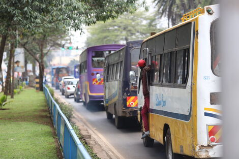     Cars in traffic along the Uhuru Expressway, Nairobi