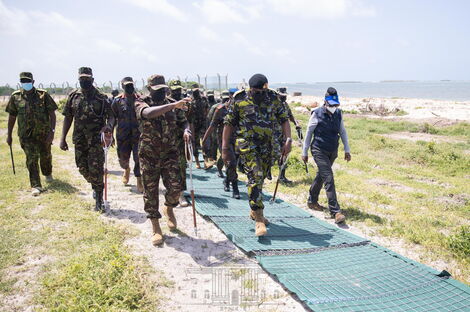 Chief of Defence Forces (CDF) Gen Robert Kibochi guides President Uhuru Kenyatta and Defense CS Dr. Monica Juma in a tour of the Boni Training Camp.