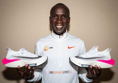 Eliud Kipchoge Holding His Running Shoes That Were Placed on Auction on Catawiki Website Starting From September 25