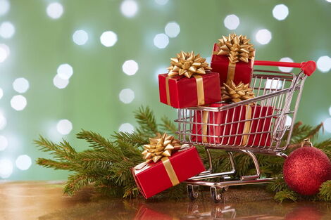 A shopping cart with Christmas Gifts