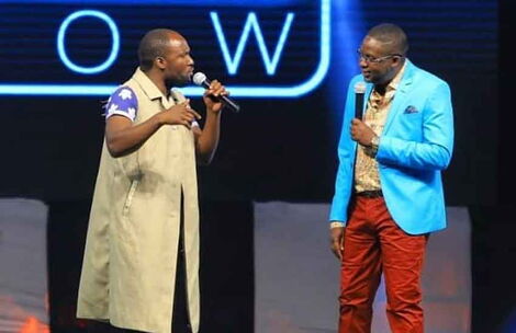 Comedy actor Steven Oduor Dede alias DJ Shiti (Left) and Daniel Churchill Ndambuki performing on stage.
