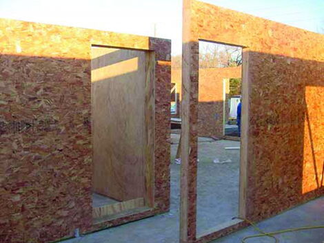 Compressed Agricultural Fiber (CAF) panel house under construction.