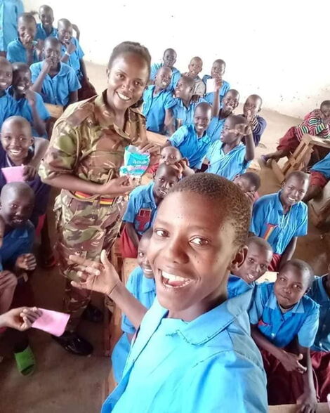 Constable Caroline Makena interacting with students in Elgeyo-Marakwet during a community outreach drive.