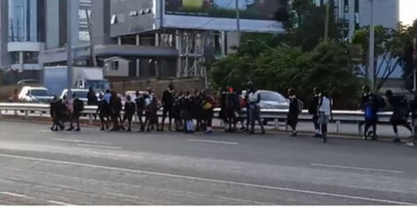 File photo of school going kids waiting to cross the road near Desmond Tutu center in Westlands
